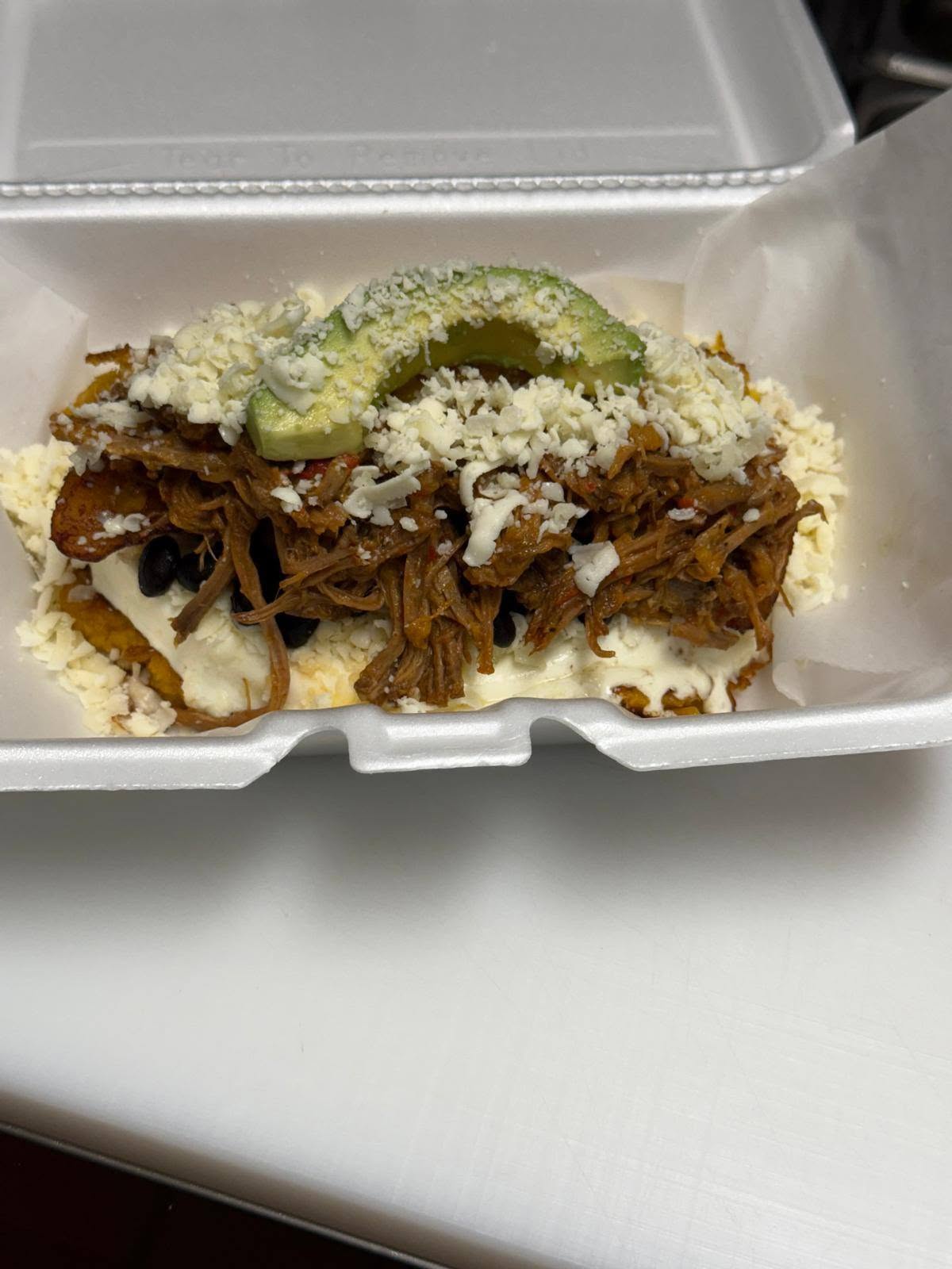 Shredded beef, cheese and avocado on a to-go plate from the 1Chick 1Bro kitchen